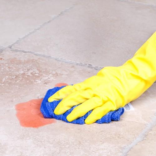 Wiping up a spill on a tile floor | Flooring Direct