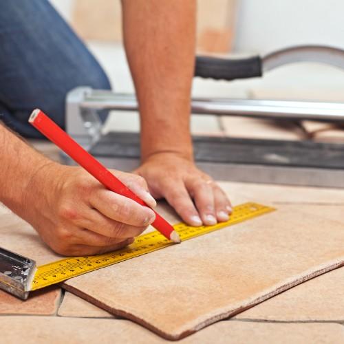 Man installing tile | Flooring Direct