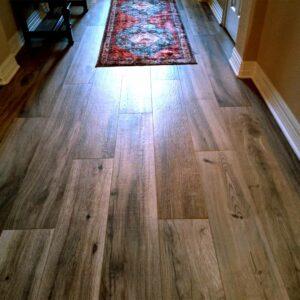 Valley Ridge Wood Plank Ceramic Tile (8" x 48") "New Kent II" in Gray with Chamois grout installed by Flooring Direct DFW
